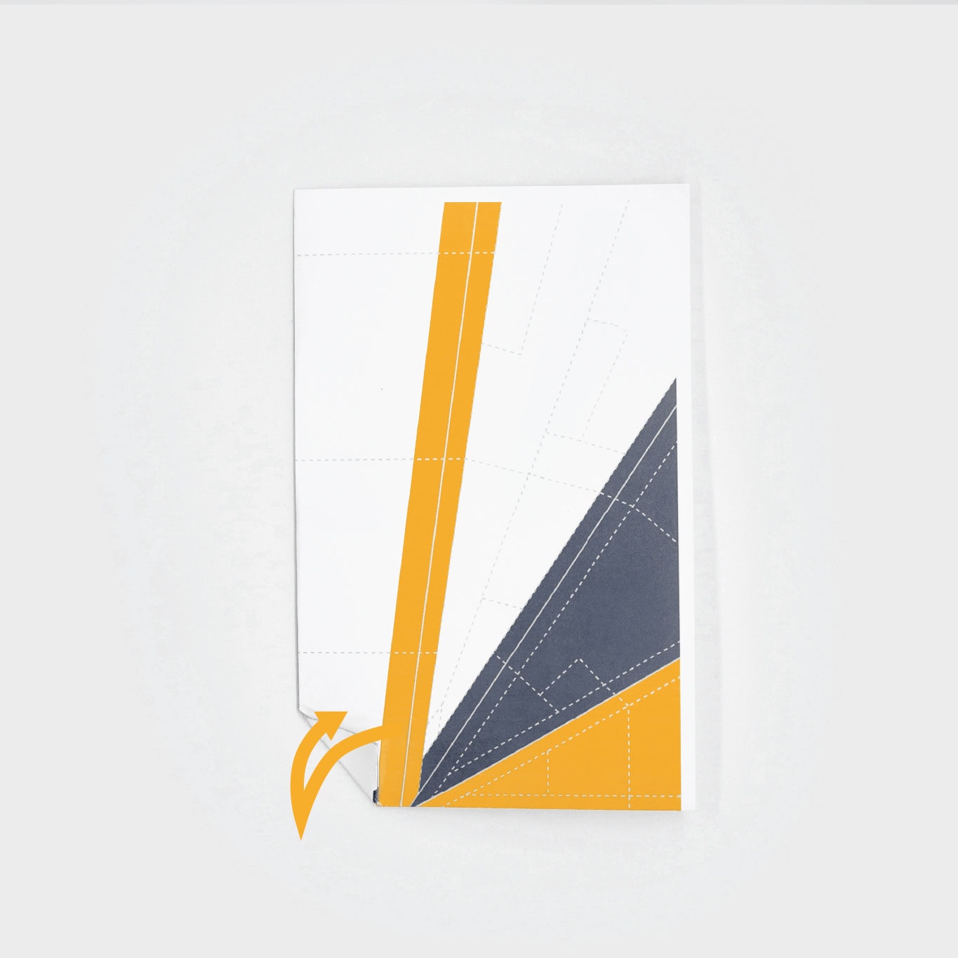 Crease the nose of the paper plane by creating a triangle in the nose by folding it back and forth.