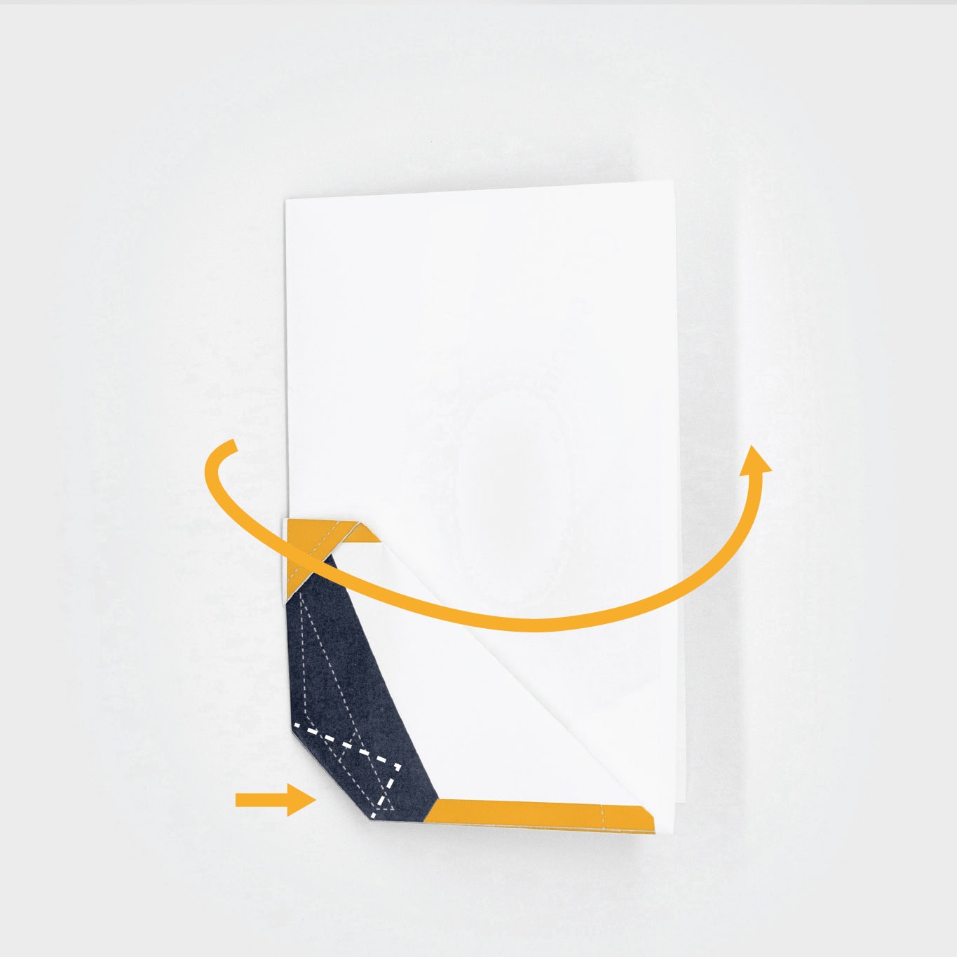 Reverse the center fold so that the graphics are on the inside and softly press the triangle fold so that it folds inside the plane.