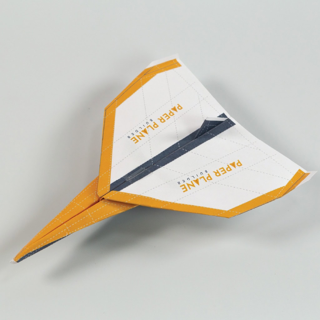 Add a small piece of tape to the middle of the plane to hold it's shape.