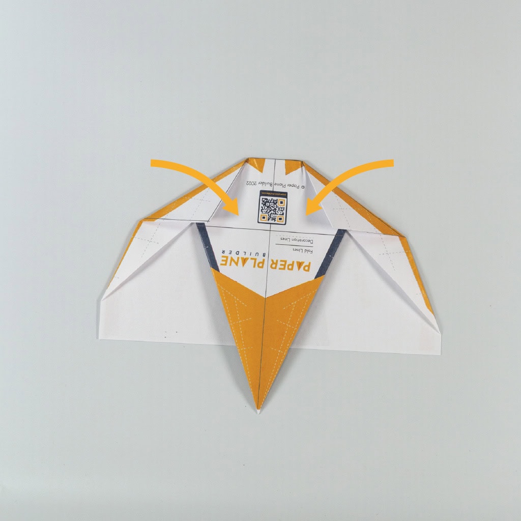 fold the newly created top right and left corners inward to meet the provided horizontal line.