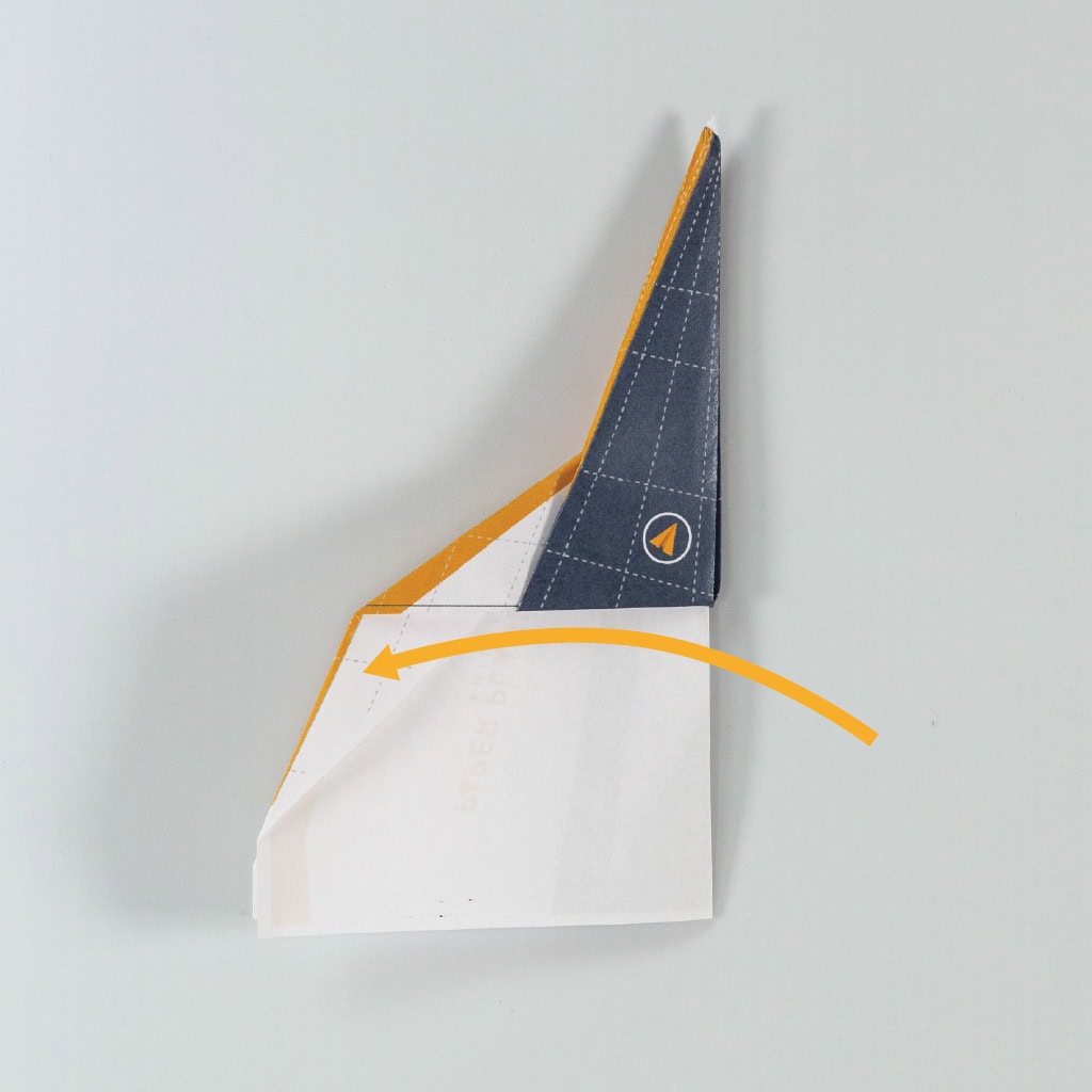 Fold the plane in half to create the fuselage.