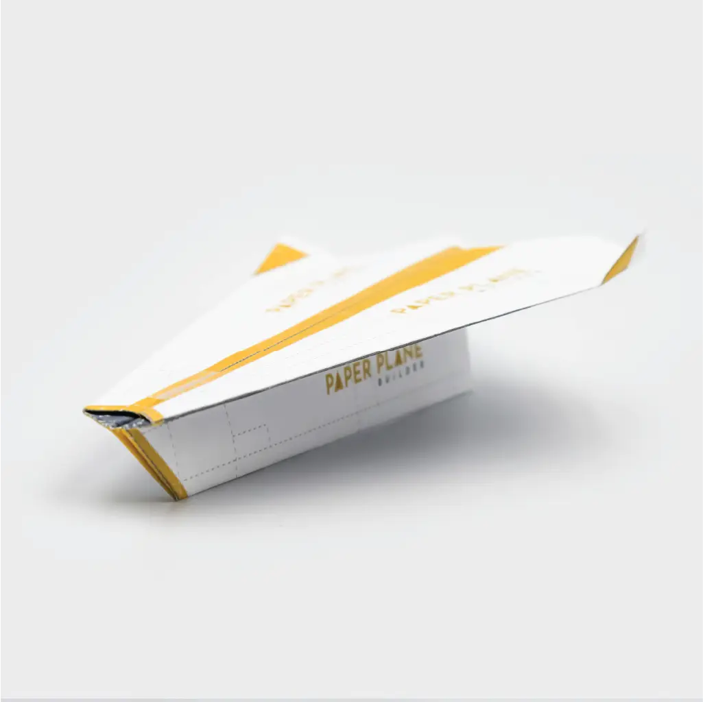 To maintain the paper planes shape add a small piece of tape to the top of the plane.