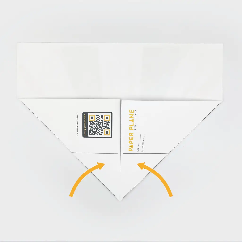 Next, fold both bottom corners inward to meet in the middle.