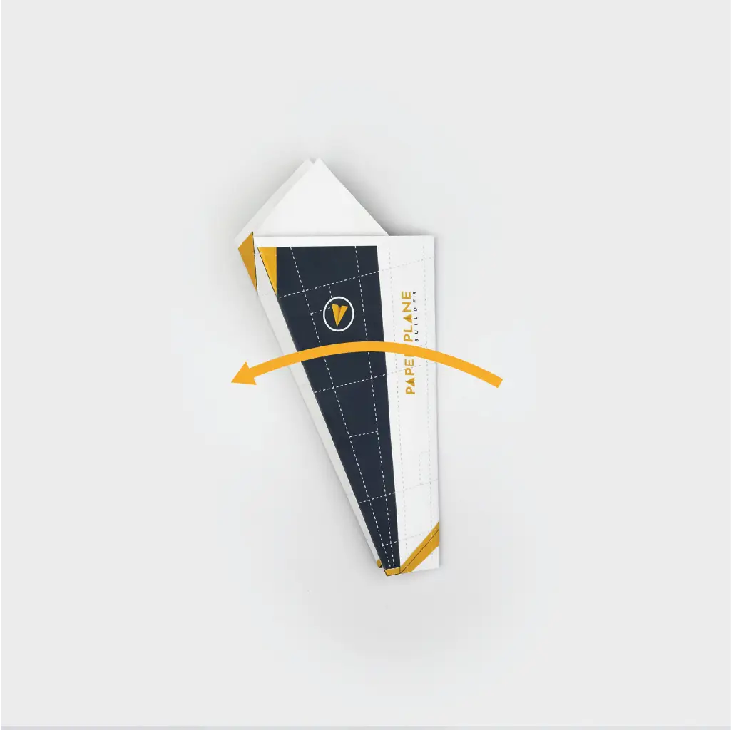 Next, fold the plane in half to create the fuselage.