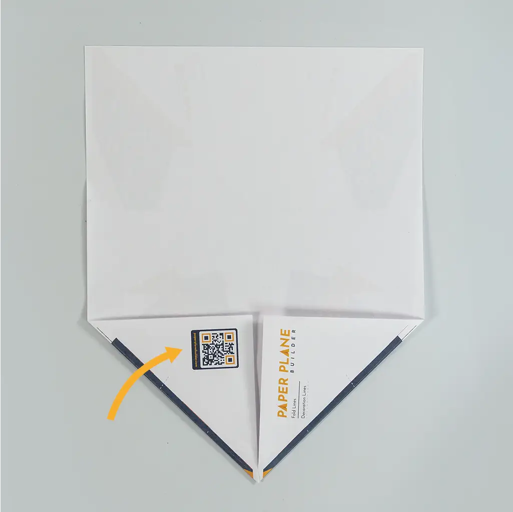 Fold both bottom corners inward to meet in the middle.