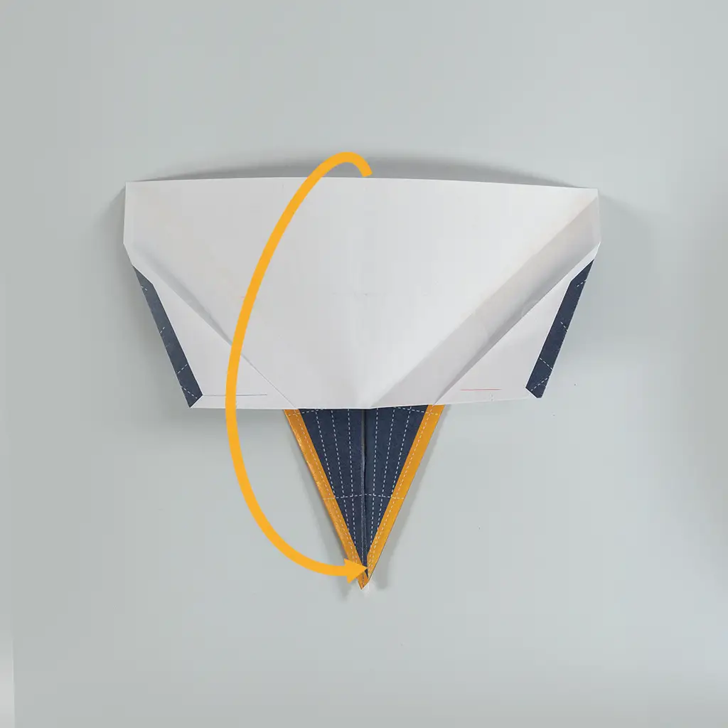 Turn the plane over so that the unprinted side is pointing up and the nose is pointing toward you.