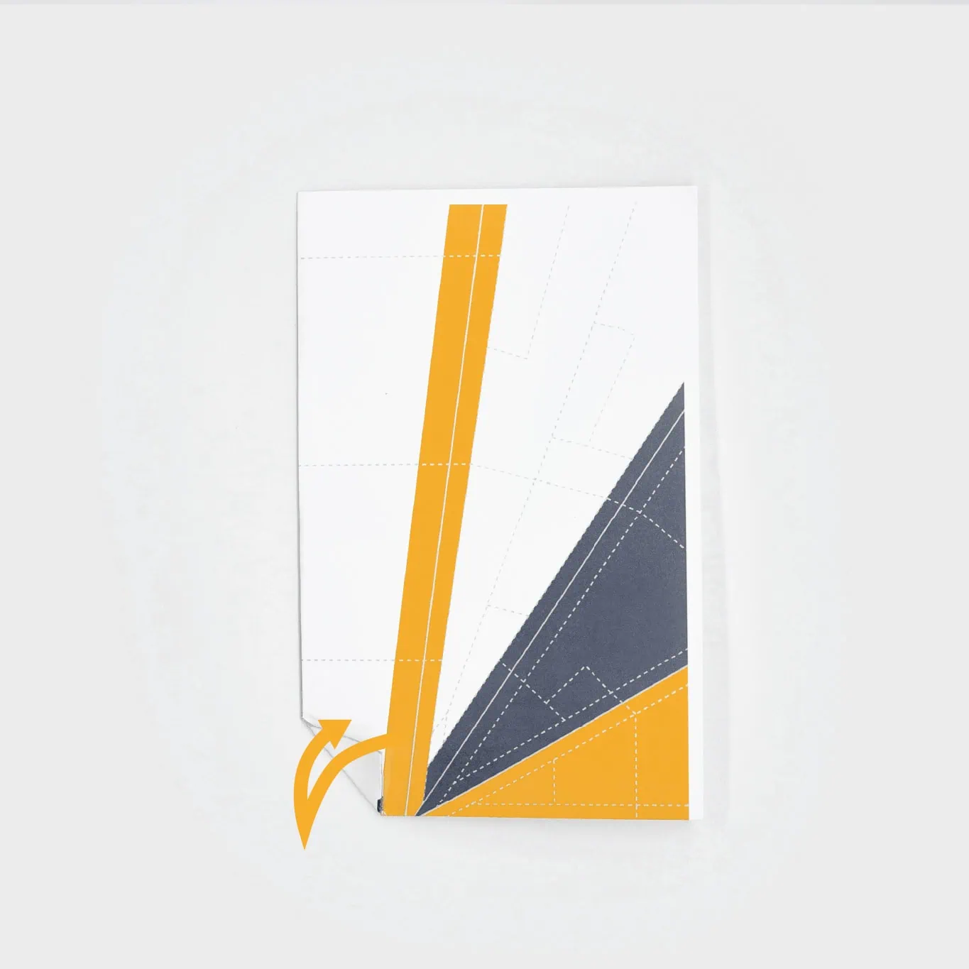 Crease the nose of the paper plane by creating a triangle in the nose by folding it back and forth.