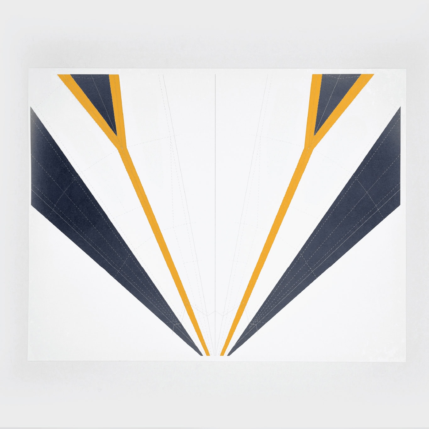 Start by laying the template on a flat surface with the graphics pointing up and the nose pointing toward you.