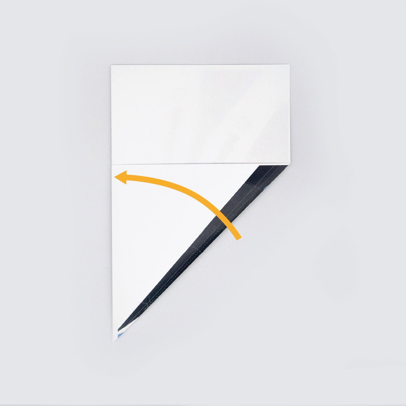 Fold the bottom right corner upward to meet along the left edge. Mirror that fold on the opposite side.