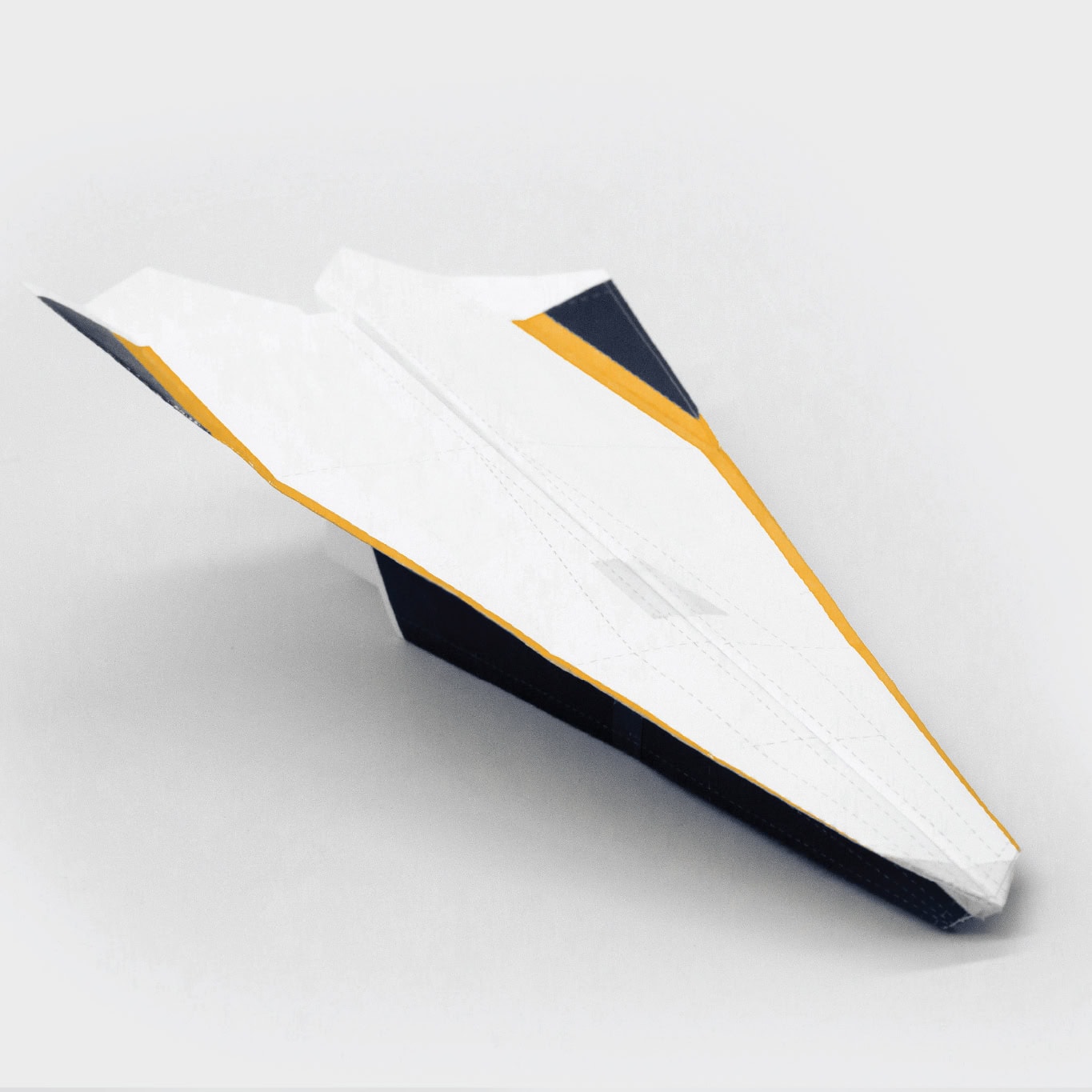 Finally, add a small piece of tape to the top, nose and bottom of the plane.